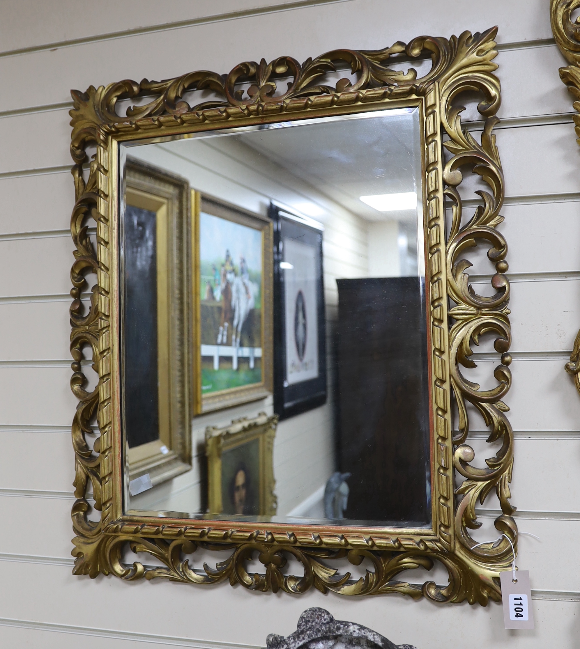 An early 20th century Florentine style rectangular carved giltwood and composition wall mirror, width 64cm, height 74cm